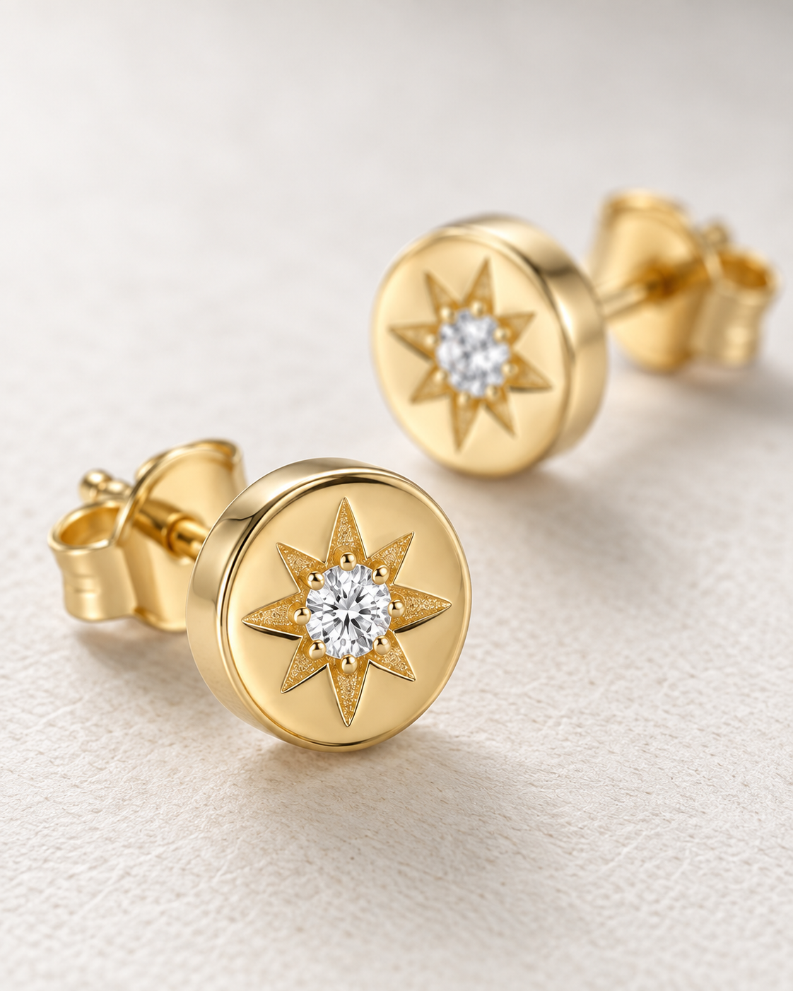 Close-up of Lab Grown Diamond Starburst Studs, showing the gold finish over sterling silver