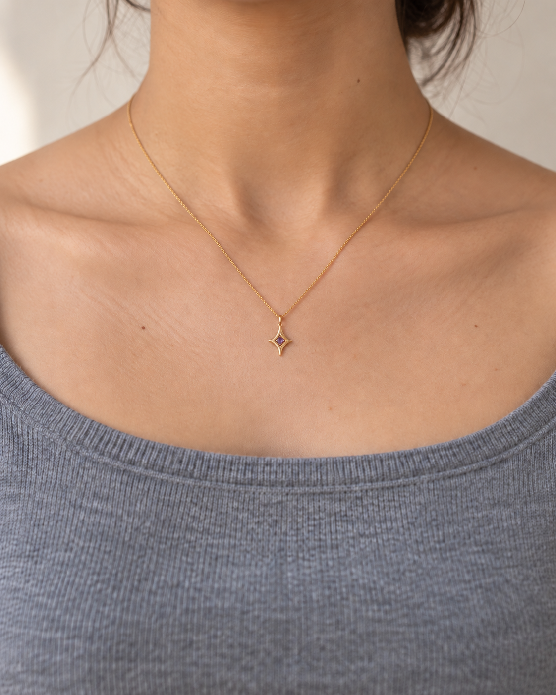 Close-up of the Natural amethyst and its setting in Amethyst Four-Point Star Pendant