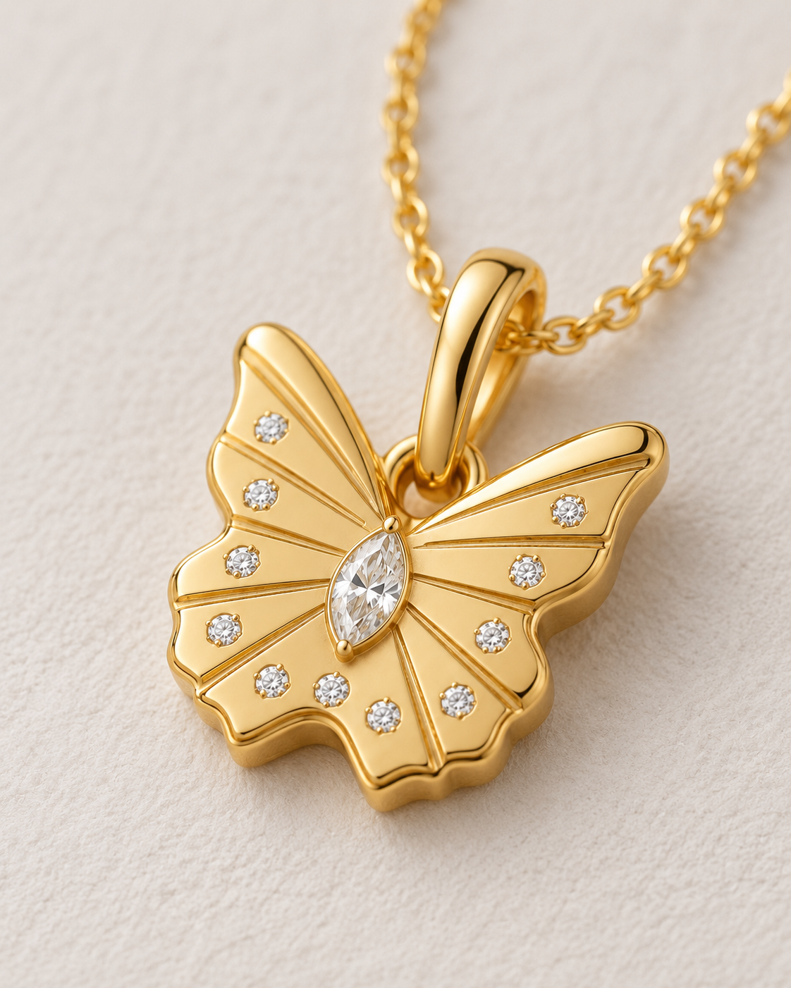 Close-up of Lab Grown Diamond Butterfly Pendant, showing the gold finish over sterling silver