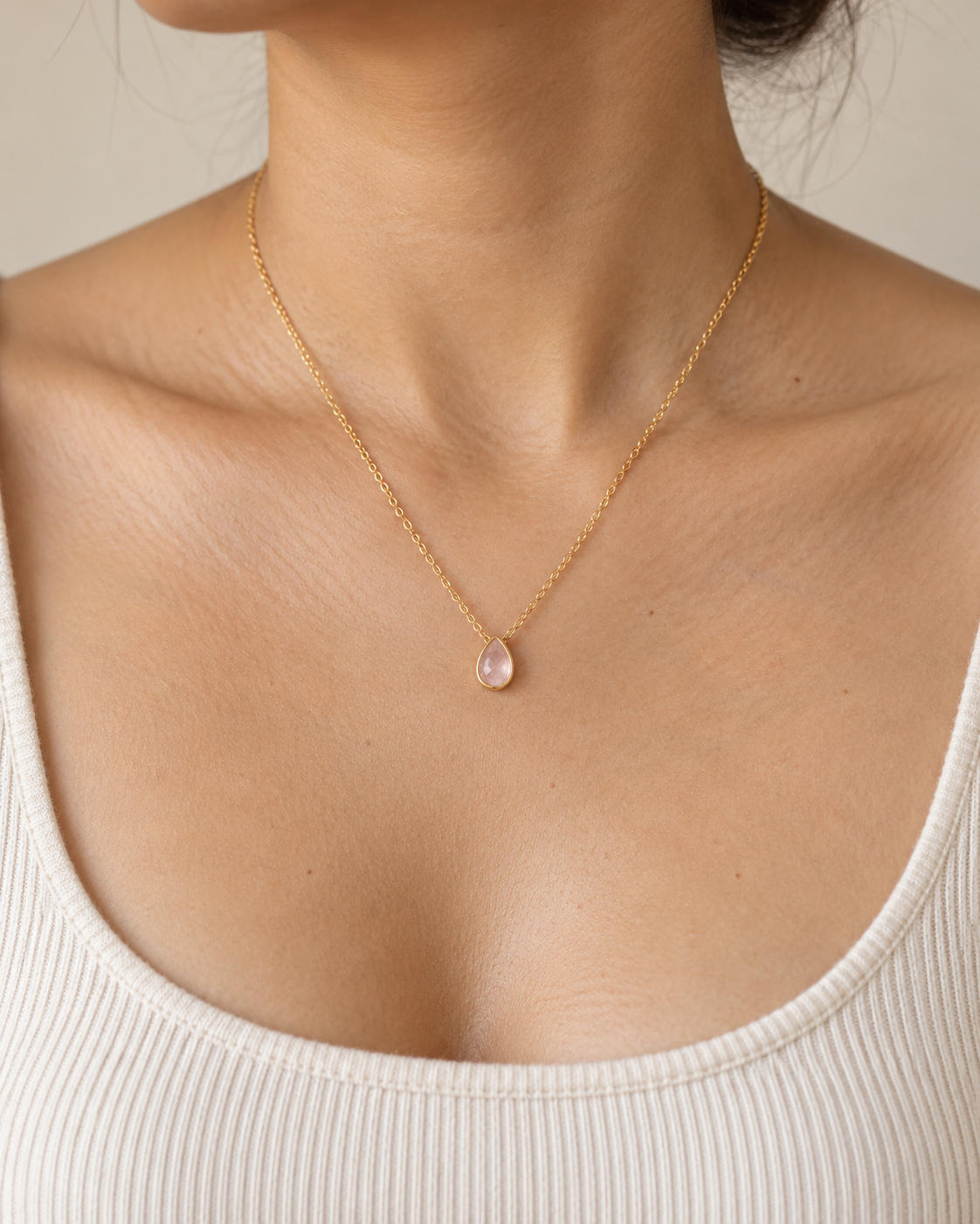 Close-up of the Natural rose quartz and its setting in Rose Quartz Pear Bezel Pendant
