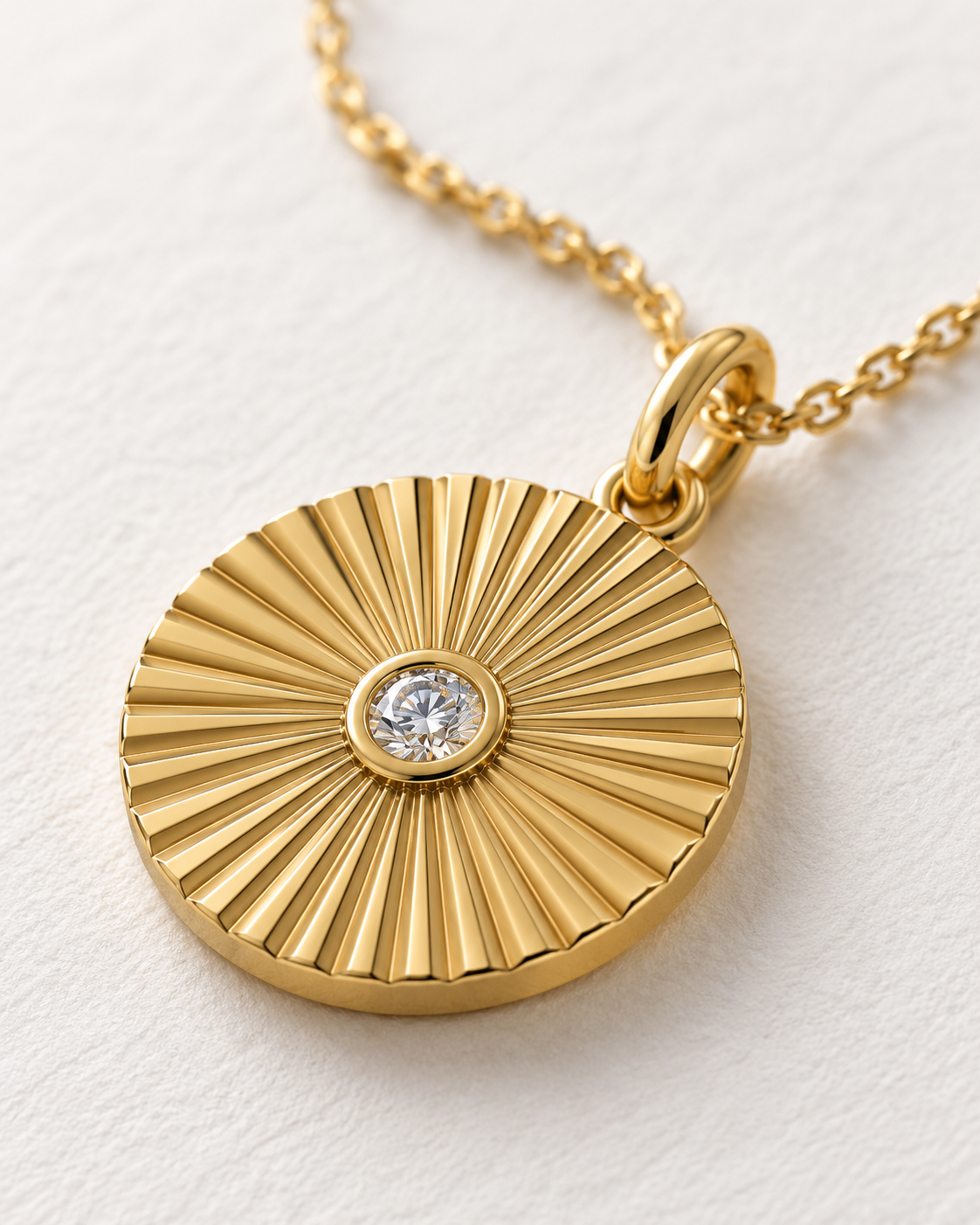 Close-up of Lab Grown Diamond Sunburst Pendant, showing the gold finish over sterling silver