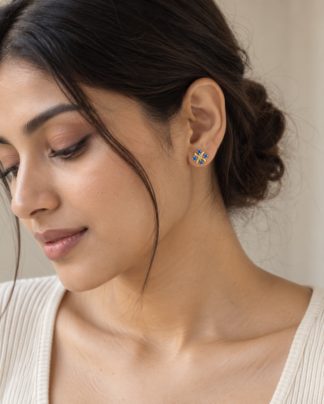 Close-up of the Natural blue topaz and its setting in Blue Topaz Cross Cluster Studs