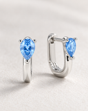 Blue Topaz Pear Drop Huggies — Carat Hills