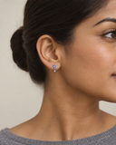 Blue Topaz Pear Drop Huggies — Carat Hills