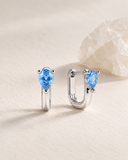 Blue Topaz Pear Drop Huggies — Carat Hills