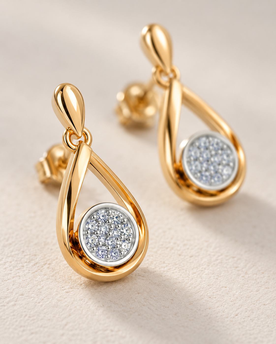 Close-up of Lab Grown Diamond Teardrop Drop Earrings, showing the gold finish over sterling silver