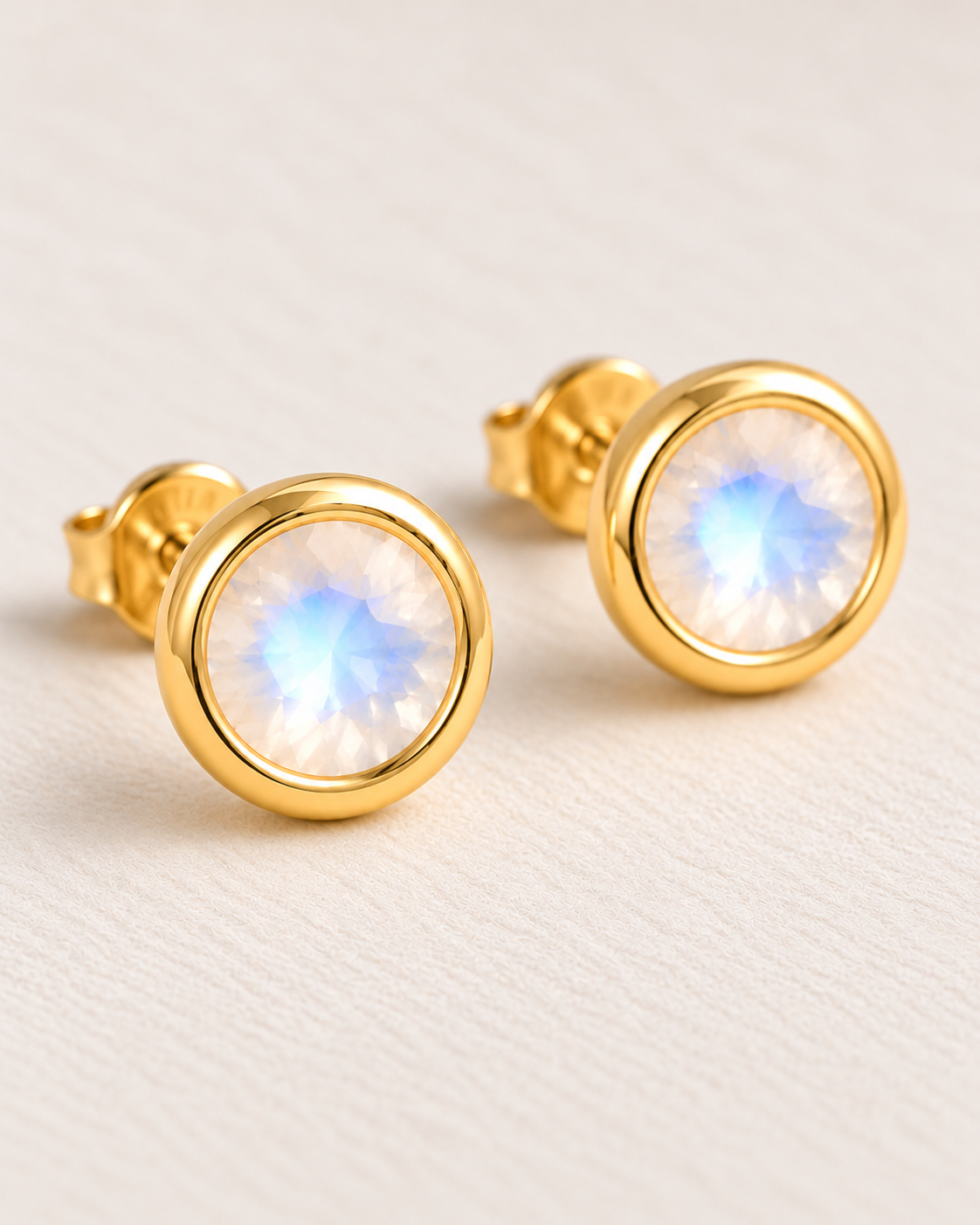 Close-up of Moonstone Round Bezel Studs, showing the gold finish over sterling silver