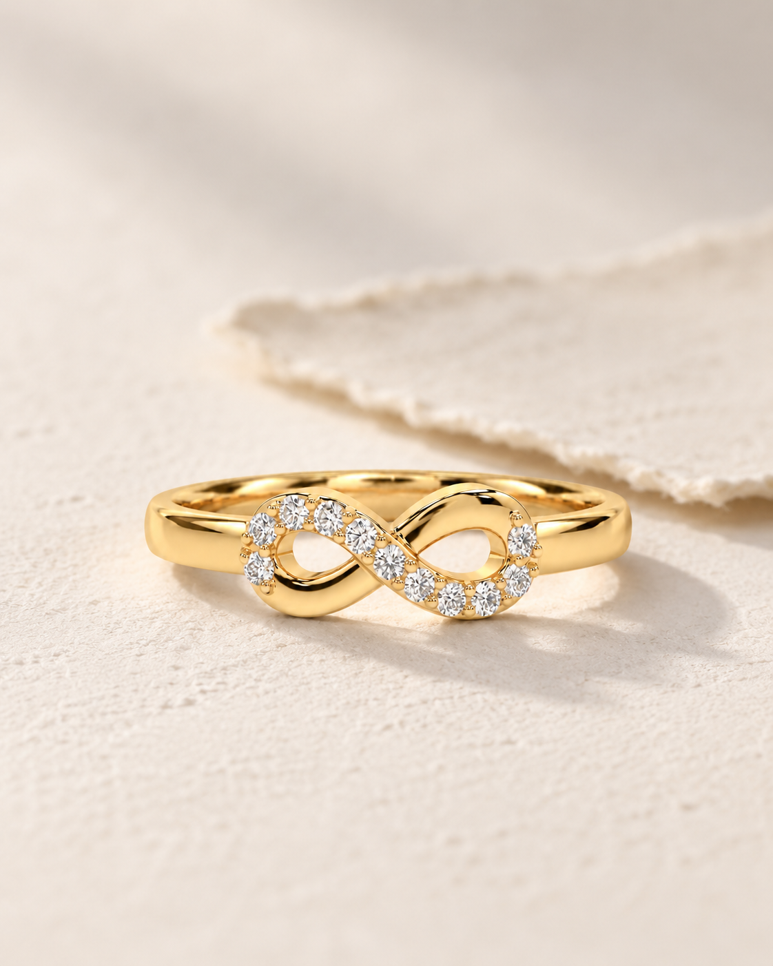 Close-up of Lab Grown Diamond Infinity Knot Ring, showing the gold finish over sterling silver